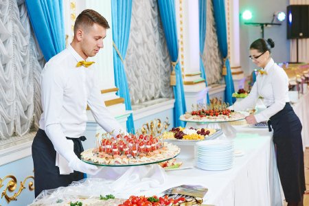Waiter serving food at an event