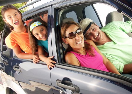 Happy family seating in car