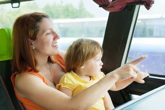 A mother and child in a commercial bus