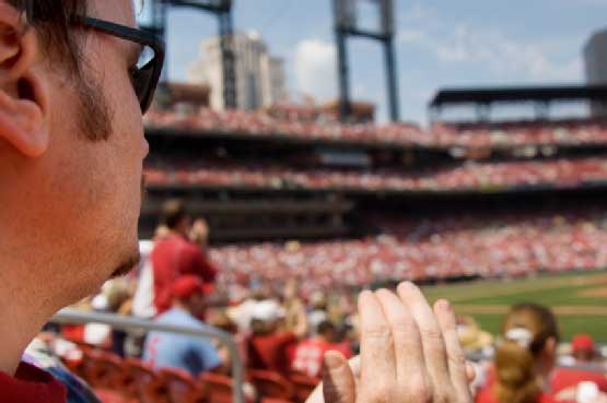 A man watching a sport event